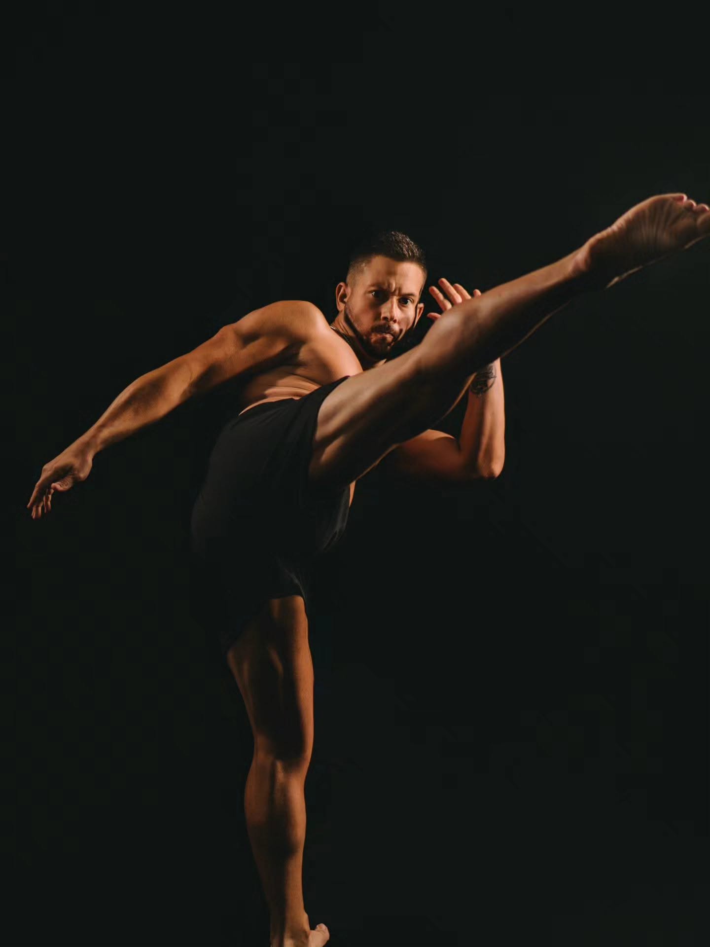 James demonstrating an airborne martial arts kick